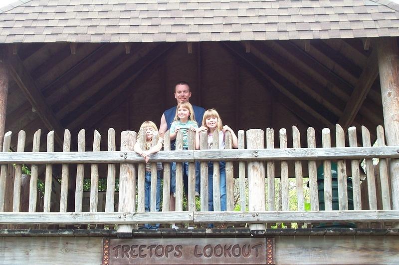 Alan and the girls in a treehouse