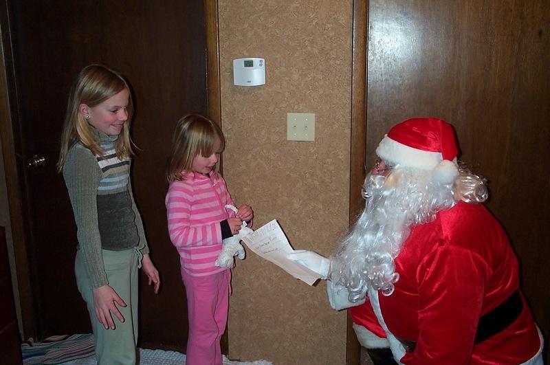 Rebecca announced the Thursday before Christmas that she wasn't sure she believed in Santa.  I emailed him that day and he came