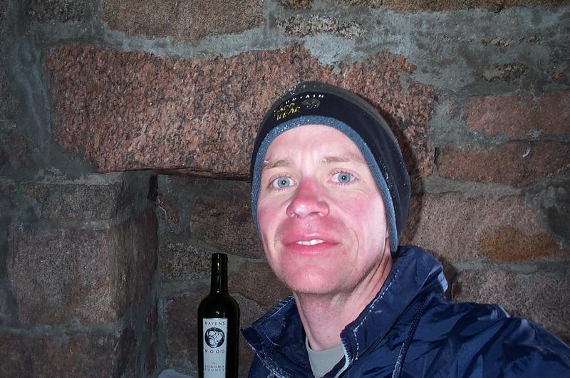 Trying to warm up a bit in the Agnes Vaille shelter house.  Some nice person even left a bottle of wine there for me!