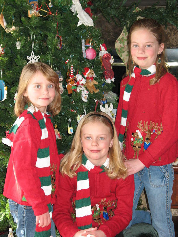 The girls pose with their new sweaters