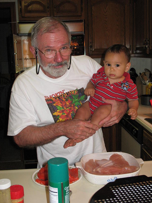 Papa Rick giving Benjamin his first cooking lesson