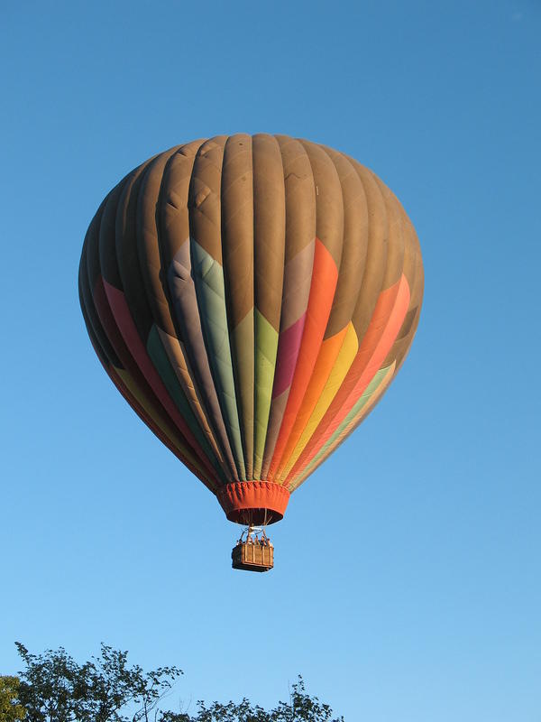 This ballon is getting into position to drop down to the lake