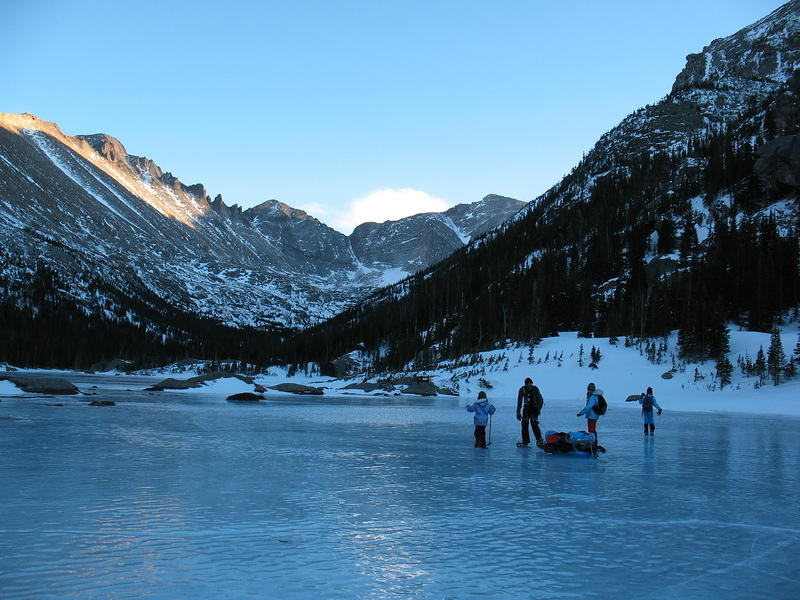 Alan and the girls cross the lake with Longs in background