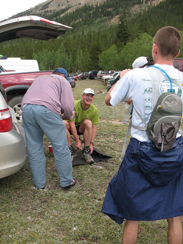 Alan takes Gerber s photos while his crew helps with a shoe change.