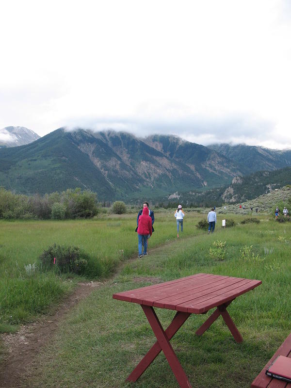 Elizabeth runs out to greet Alan as he comes back in to Twin Lakes.