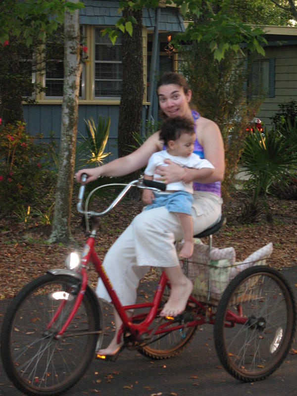 Benjamin and Mary ride the three wheeler