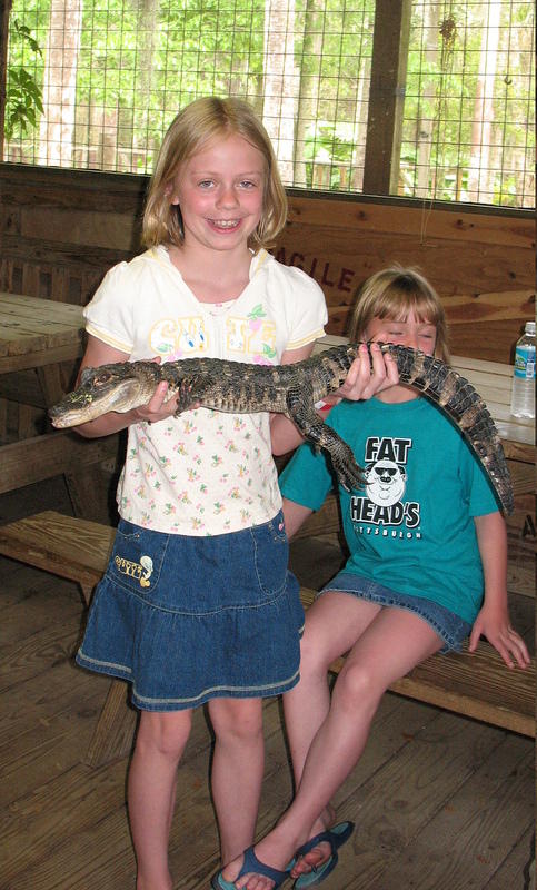 Hannah holds the baby gator