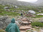 us trekking up the moraine in the rain