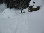 Alan skies behind the sled with our gear down a tremendous hill