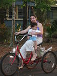 Benjamin and Mary ride the three wheeler