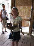 Carolyn laughs as Hannah tries look nonchalant about holding the snake